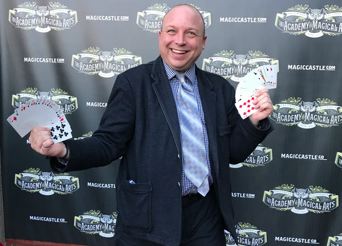 Clive Hayward performing close-up card magic at a Seattle event